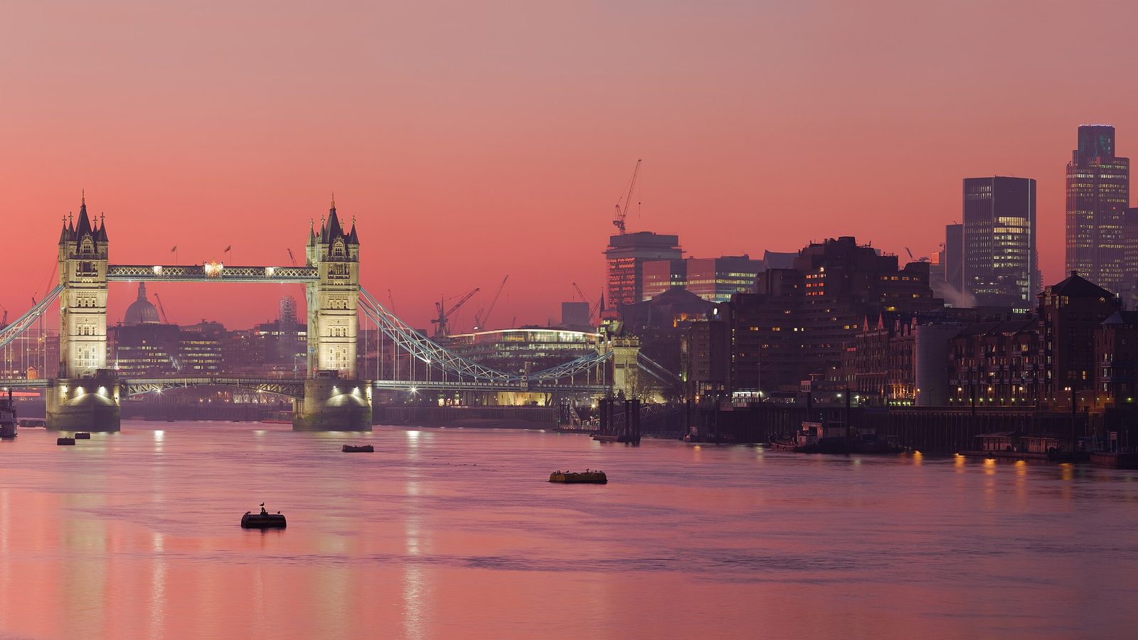 The City of London financial district and the River Thames at dusk.