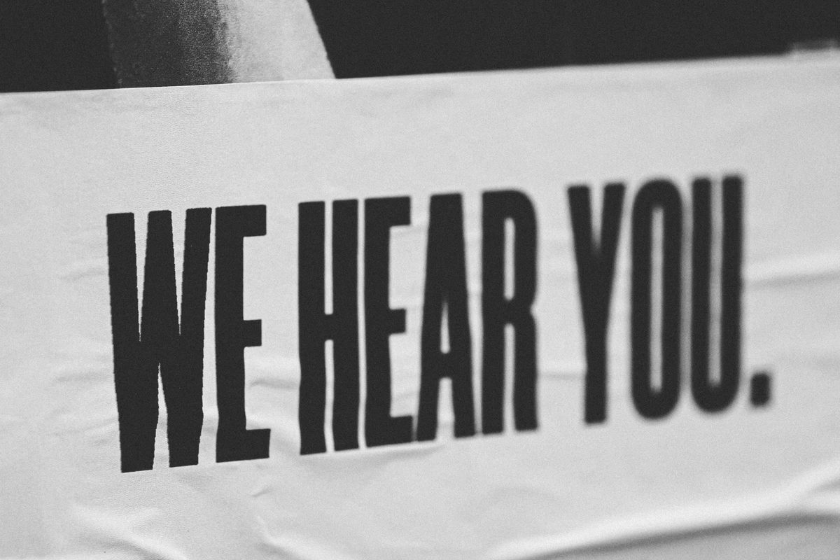 a banner reading we hear you